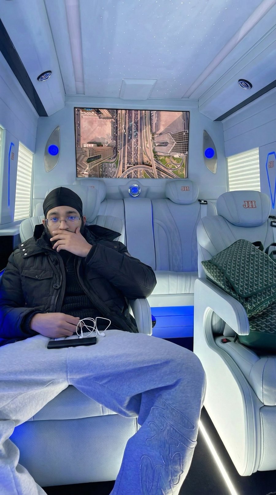 Jaidev Bhogal in the back of a luxury chauffeured van